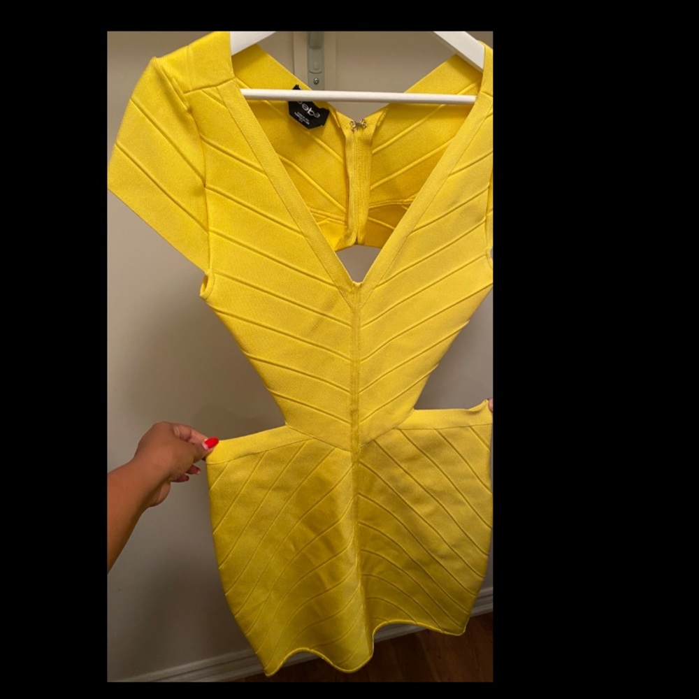 Bright yellow BEBE bandage cutout dress